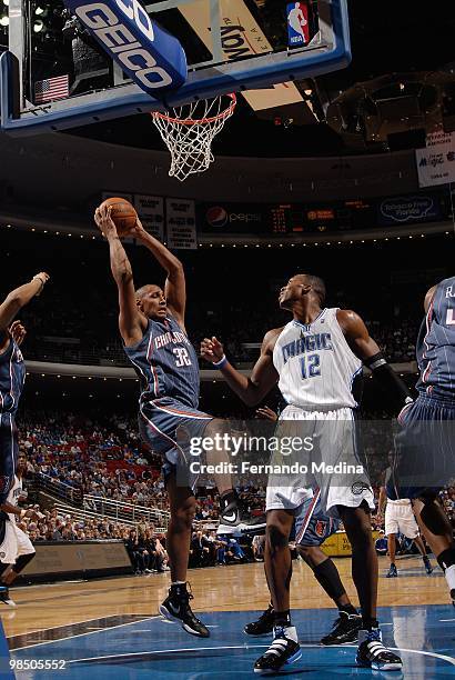 Boris Diaw of the Charlotte Bobcats rebounds against Dwight Howard of the Orlando Magic during the game on March 14, 2010 at Amway Arena in Orlando,...