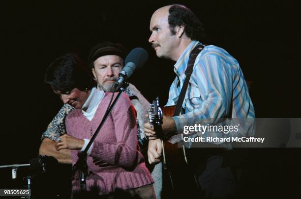 Joan Baez, Pete Seeger and Tom Paxton perform live at The Greek Theatre in 1980 in Berkeley, California.