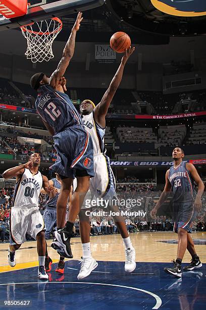 Zach Randolph of the Memphis Grizzlies lays up a shot against Tyrus Thomas of the Charlotte Bobcats during the game on February 26, 2010 at...