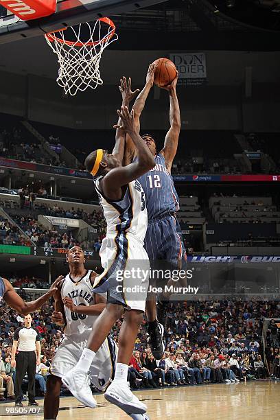 Tyrus Thomas of the Charlotte Bobcats rebounds against Zach Randolph of the Memphis Grizzlies during the game on February 26, 2010 at FedExForum in...