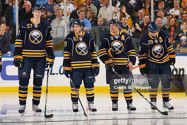 Tyler Myers of the Buffalo Sabres stands with teammates Tyler Ennis, Derek Roy, and Jason Pominville before their game with the Boston Bruins in Game...