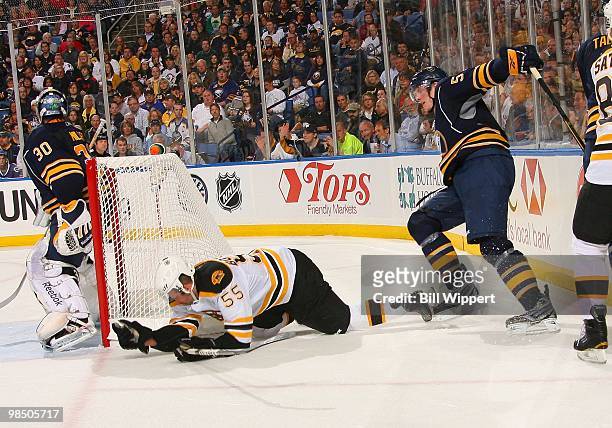 Tyler Myers of the Buffalo Sabres checks Johnny Boychuk of the Boston Bruins in Game One of the Eastern Conference Quarterfinals during the 2010 NHL...