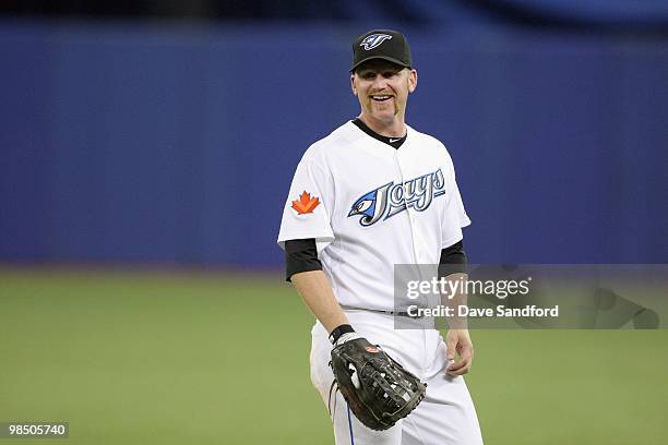 Lyle Overbay of the Toronto Blue Jays smiles on the field during the game against the Chicago White Sox at the Rogers Centre on April 12, 2010 in...