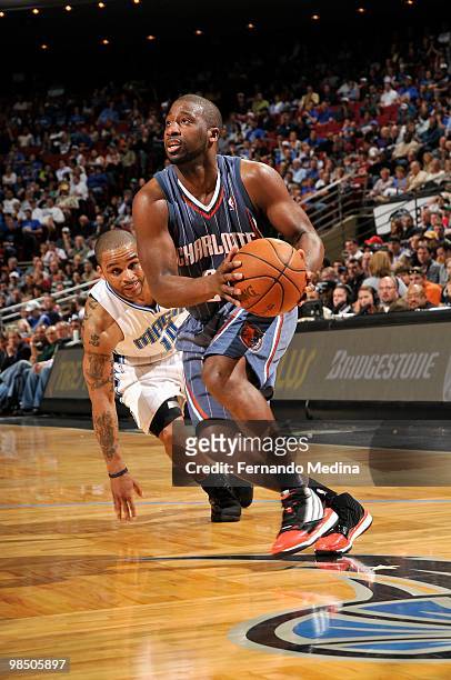 Raymond Felton of the Charlotte Bobcats moves the ball past Jameer Nelson of the Orlando Magic during the game on March 14, 2010 at Amway Arena in...