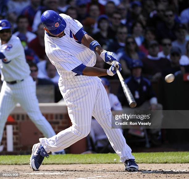 Derrek Lee of the Chicago Cubs hits a three run home run in the seventh inning against the Houston Astros on April 16, 2010 at Wrigley Field in...