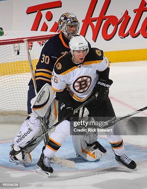 Blake Wheeler of the Boston Bruins works in front of Ryan Miller of the Buffalo Sabres in Game One of the Eastern Conference Quarterfinals during the...