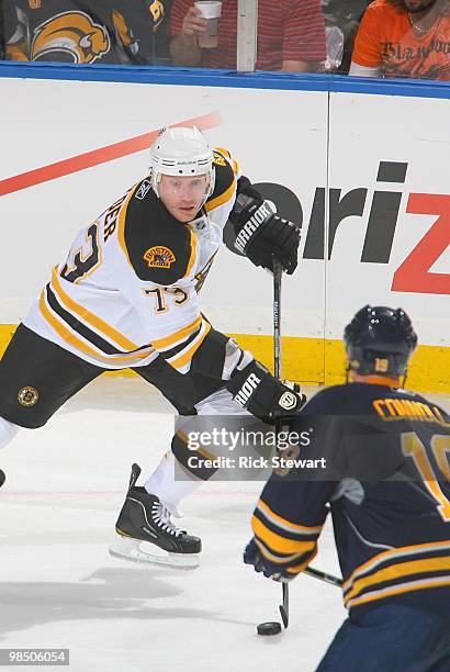 Michael Ryder of the Boston Bruins skates against Tim Connolly of the Buffalo Sabres in Game One of the Eastern Conference Quarterfinals during the...