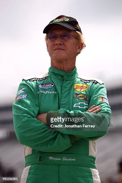 Morgan Shepherd, driver of the Racing with Jesus Chevrolet, stands on the grid during qualifying for the NASCAR Nationwide Series O'Reilly Auto Parts...