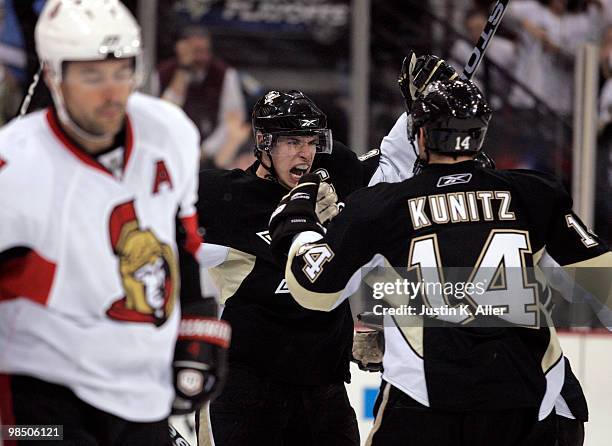 Sidney Crosby of the Pittsburgh Penguins celebrates his goal with Chris Kunitz against the Ottawa Senators in Game Two of the Eastern Conference...