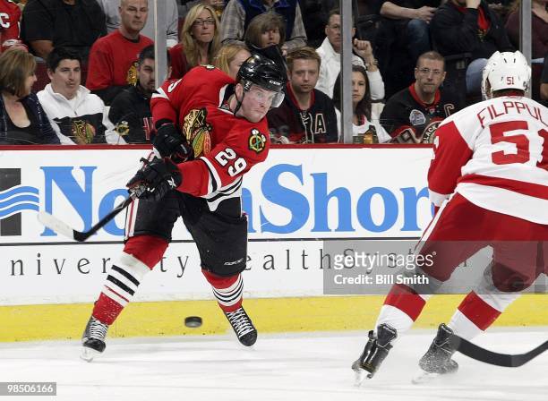 Bryan Bickell of the Chicago Blackhawks shoots the puck during a game against the Detroit Red Wings on April 11, 2010 at the United Center in...