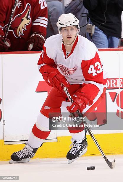 Darren Helm of the Detroit Red Wings skates with the puck in Game One of the Western Conference Quarterfinals against the Phoenix Coyotes during the...