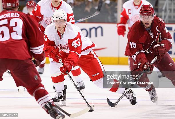 Darren Helm of the Detroit Red Wings skates with the puck in Game One of the Western Conference Quarterfinals against the Phoenix Coyotes during the...