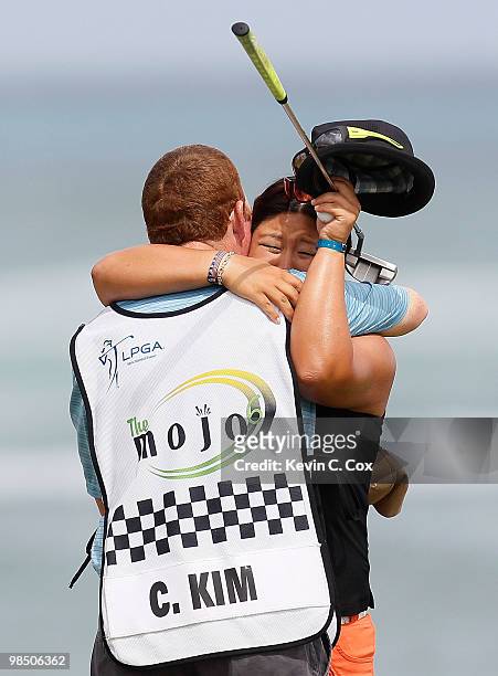 Christina Kim reacts with her caddie after losing her quarterfinal match of The Mojo 6 Jamaica LPGA Invitational at Cinnamon Hill Golf Course on...
