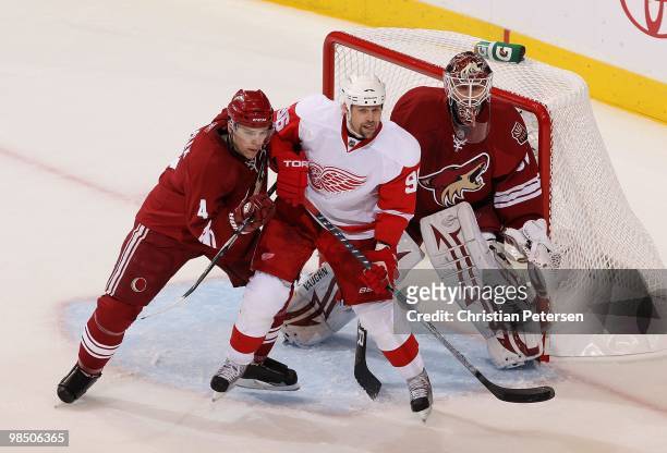 Tomas Holmstrom of the Detroit Red Wings attempts to set a screen on goaltender Ilya Bryzgalov of the Phoenix Coyotes in Game One of the Western...