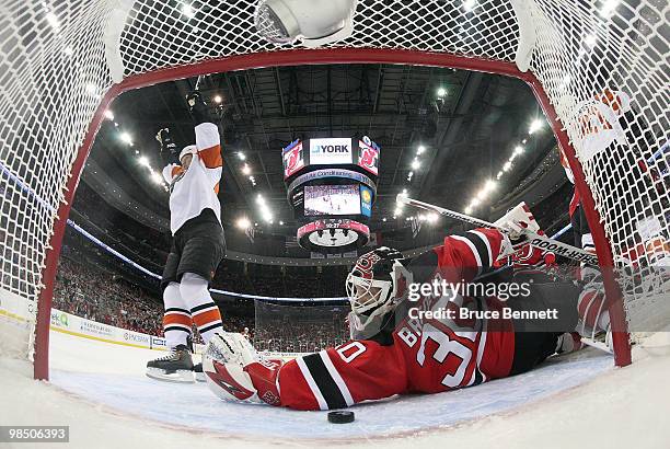 Arron Asham of the Philadelphia Flyers scores a first period goal against the New Jersey Devils in Game Two of the Eastern Conference Quarterfinals...