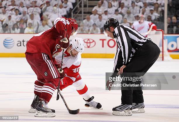 Henrik Zetterberg of the Detroit Red Wings faces off against Vernon Fiddler of the Phoenix Coyotes in Game One of the Western Conference...