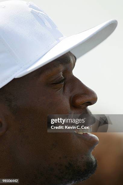 Usain Bolt stands in the gallery as he watches the quarterfinal matches of The Mojo 6 Jamaica LPGA Invitational at Cinnamon Hill Golf Course on April...