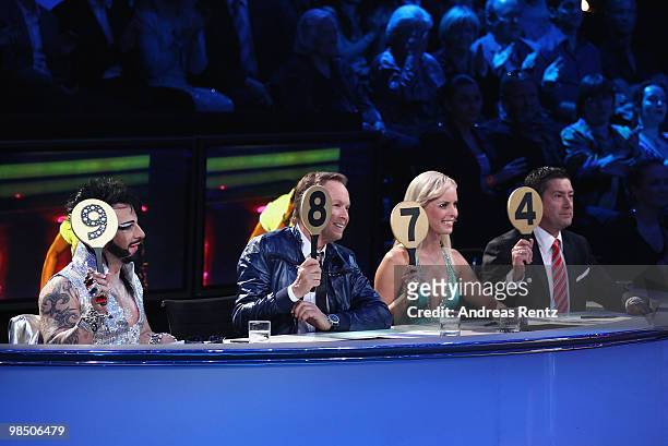 The jury Harald Gloeoeckler, Peter Kraus, Isabel Edvardsson and Joachim Llambi hold up their scores card during the 'Let's Dance' TV show at Studios...