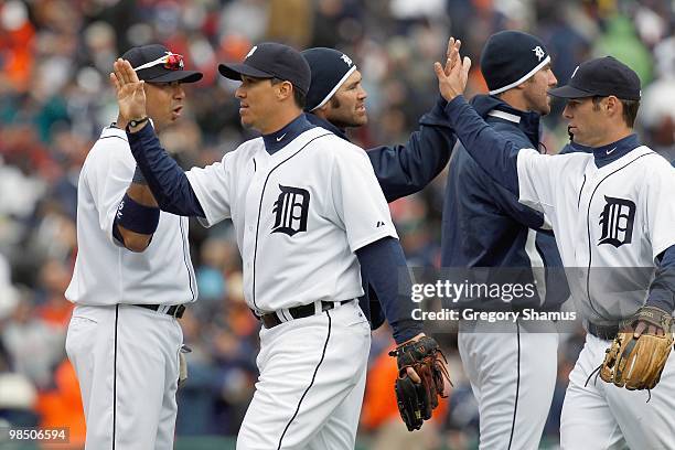 Magglio Ordonez of the Detroit Tigers celebrates with Carlos Guillen against the Cleveland Indians after winning Opening Day on April 9, 2010 at...