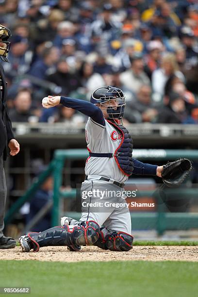 Catcher Mike Redmond of the Cleveland Indians throws the ball to the mound against the Detroit Tigers during Opening Day on April 9, 2010 at Comerica...