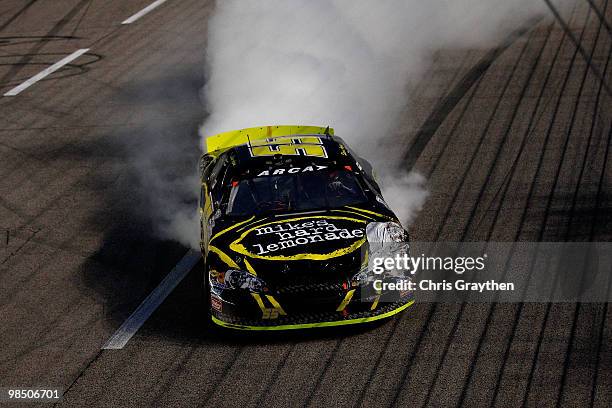 Steve Arpin, driver of the Fort Frances Ontario, performs a burnout after winning the ARCA Racing Series Rattlesnake 150 at Texas Motor Speedway on...