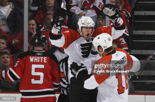 Chris Pronger and Mike Richards of the Philadelphia Flyers celebrate a second period power play goal by Kimmo Timonen against the New Jersey Devils...