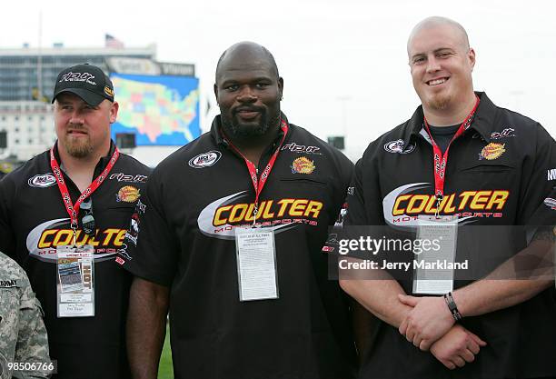 Cory Procter, Leonard Davis and Marc Colombo of the Dallas Cowboys stand during prerace ceremonies for the ARCA Racing Series Rattlesnake 150 at...