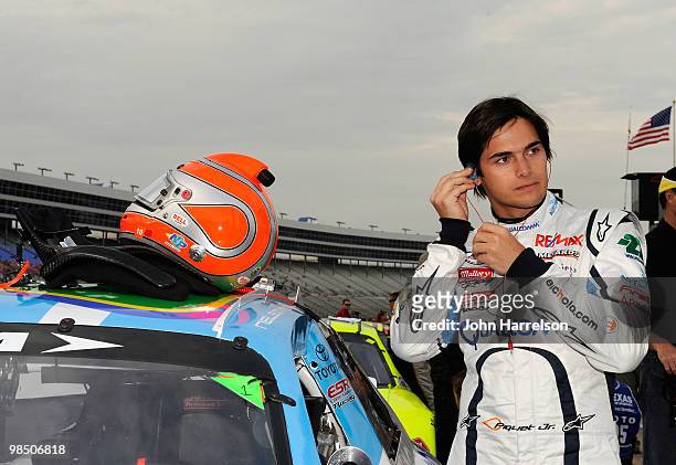 Nelson Piquet, driver of the Qialcomm-ESR Toyota, looks on from the grid prior to the start of the ARCA Racing Series Rattlesnake 150 at Texas Motor...