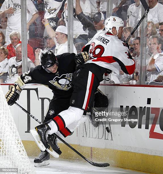 Matt Cooke of the Pittsburgh Penguins collides with Matt Carkner of the Ottawa Senators in Game Two of the Eastern Conference Quaterfinals during the...