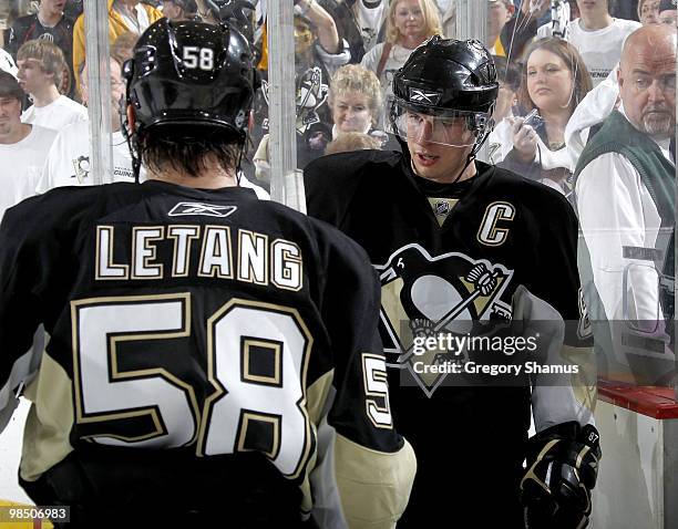 Sidney Crosby of the Pittsburgh Penguins celebrates with Kris Letang after a 2-1 victory over the Ottawa Senators in Game Two of the Eastern...