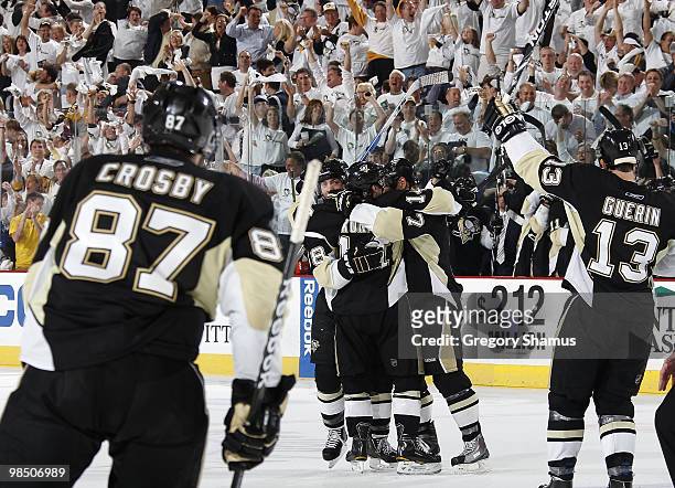 Kris Letang of the Pittsburgh Penguins celebrates his game winning goal with teammates against the Ottawa Senators in Game Two of the Eastern...