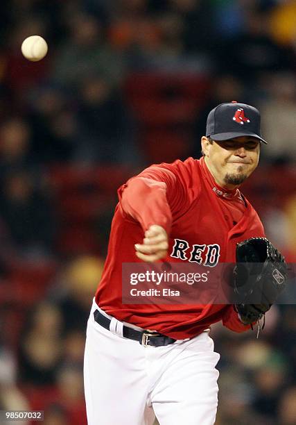 Josh Beckett of the Boston Red Sox throws back to first in attempt to catch a Tampa Bay Rays runner on April 16, 2010 at Fenway Park in Boston,...