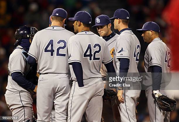 The Tampa Bay Rays gather on the pitchers mound in the fourth inning against the Boston Red Sox on April 16, 2010 at Fenway Park in Boston,...