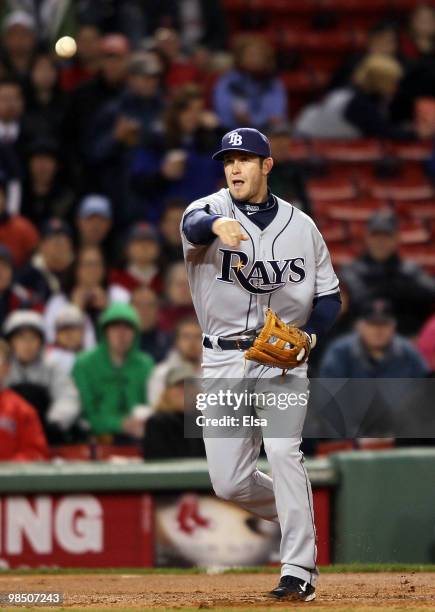 Evan Longoria of the Tampa Bay Rays sends the ball to first for the out against the Boston Red Sox on April 16, 2010 at Fenway Park in Boston,...