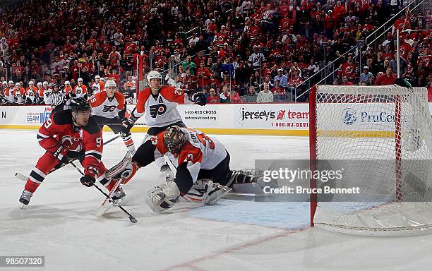 Zach Parise of the New Jersey Devils scores a short handed goal in the first period against Brian Boucher of the Philadelphia Flyers in Game Two of...