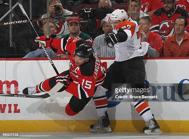 Ryan Parent of the Philadelphia Flyers checks Jamie Langenbrunner of the New Jersey Devils in Game Two of the Eastern Conference Quarterfinals during...