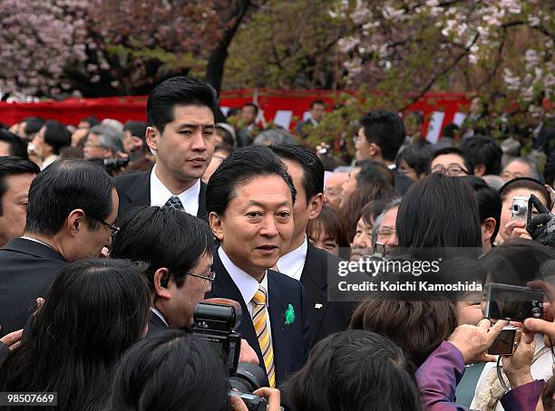 Japanese Prime Minister Yukio Hatoyama greets the crowd during the annual government cherry blossom viewing party at Shinjuku Gyoen park on April 17,...