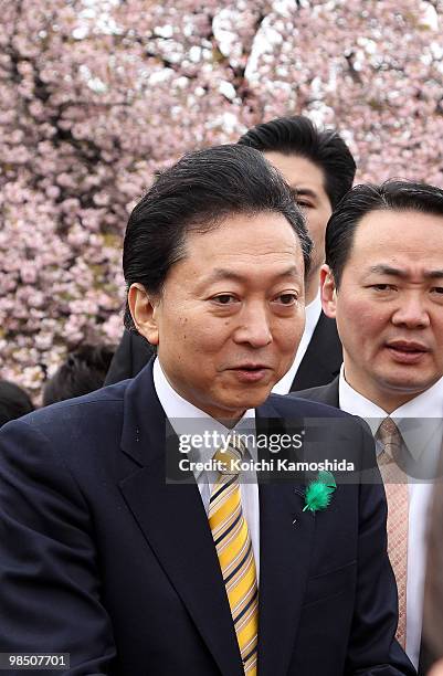 Japanese Prime Minister Yukio Hatoyama greets the crowd during the annual government cherry blossom viewing party at Shinjuku Gyoen park on April 17,...