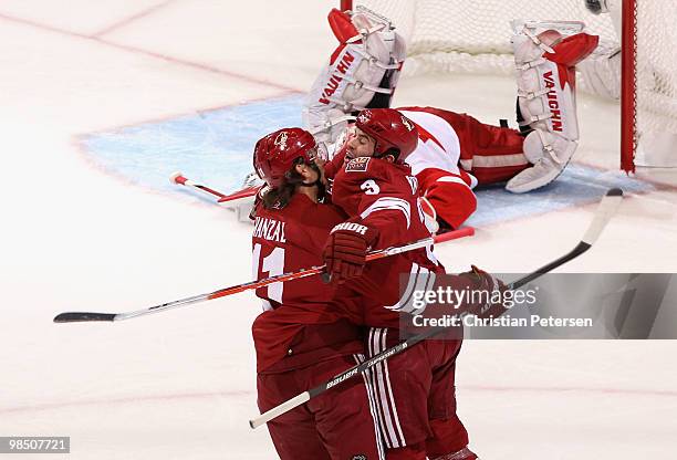 Keith Yandle and Martin Hanzal of the Phoenix Coyotes celebrate after Keith Yandle scored a first period goal past goaltender Jimmy Howard of the...