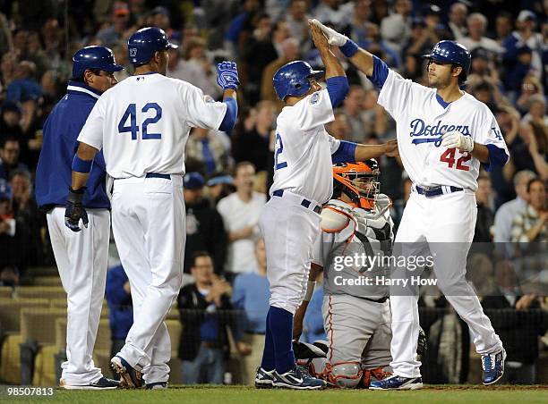 Andre Ethier of the Los Angeles Dodgers celebrates his grand slam homerun with Rafael Furcal, Matt Kemp and Vicente Padilla at home plate in front of...