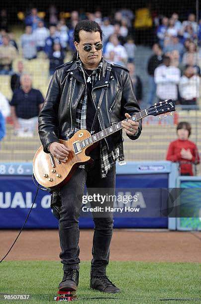 Slash of The Guns N Roses performs the national anthem before the game between the Los Angeles Dodgers and the San Francisco Giants at Dodger Stadium...