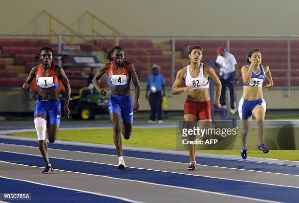 Belice's Karina Martinez and Tina Flores, Panamanian Mardel Alvarado, Nicaraguan Janahi Cornejo compete in the 100 meters race during the XI Central...