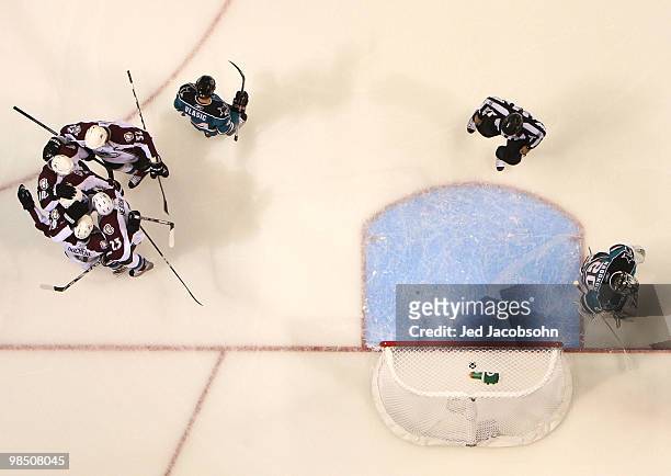 Milan Hejduk of the Colorado Avalanche celebrates with teammates after scoring past Evgeni Nabokov of the San Jose Sharks in Game Two of the Western...