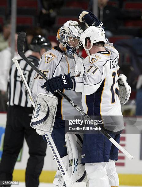 David Legwand of the Nashville Predators congratulates team goalie Pekka Rinne after winning Game One of the Western Conference Quarterfinals against...