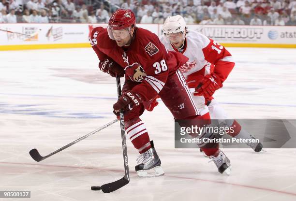 Vernon Fiddler of the Phoenix Coyotes skates with the puck past Pavel Datsyuk of the Detroit Red Wings in Game Two of the Western Conference...