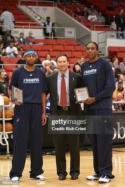 Development League Vice President of Basketball Operations Chris Alpert presents plaques honoring the selection of Mustafa Shakur and Larry Owens of...