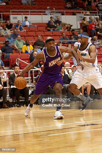 Curtis Stinson of the Iowa Energy drives by Mustafa Shakur of the Tulsa 66ers in NBA D-League second round playoff action at the Tulsa Convention...