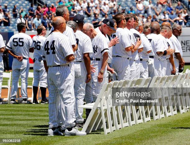 Former Yankees player Lou Piniella stand for a moment of silence honoring members of the Yankees family that passed away in the past year at New York...