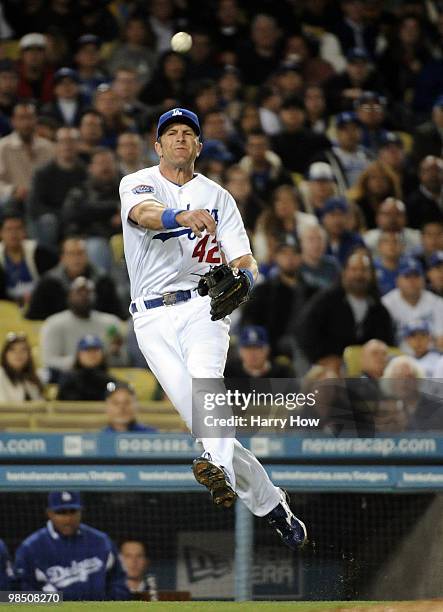 Casey Blake of the Los Angeles Dodgers makes a running throw for an out on John Bowker of the San Francisco Giants during the fifth inning at Dodger...