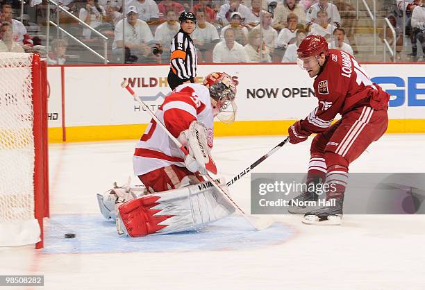 Matthew Lombardi of the Phoenix Coyotes gets the puck past Jimmy Howard of the Detroit Red Wings during second period play in Game Two of the Western...